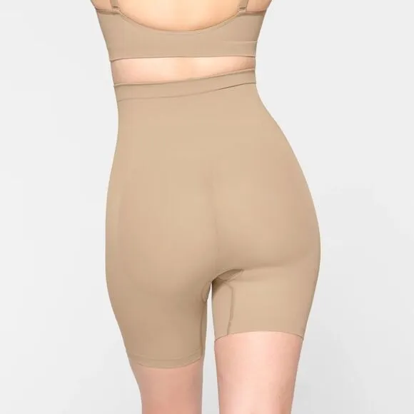 SKIMS Seamless Sculpt Mid Thigh High Waisted Tummy Control Shape Shorts In Clay